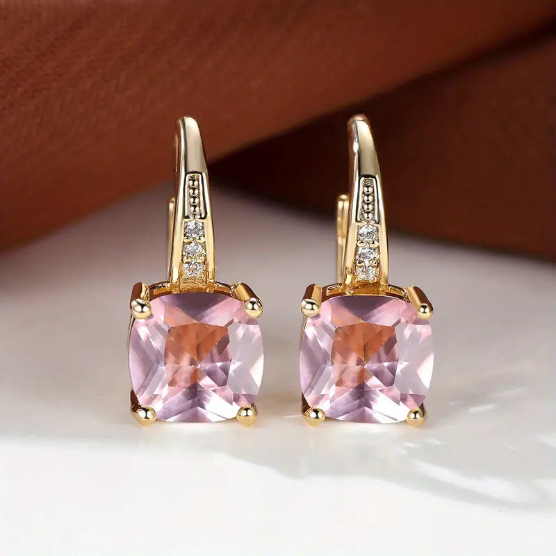 Claudine – Golden Hoop Earrings with Enigmatic Sapphire