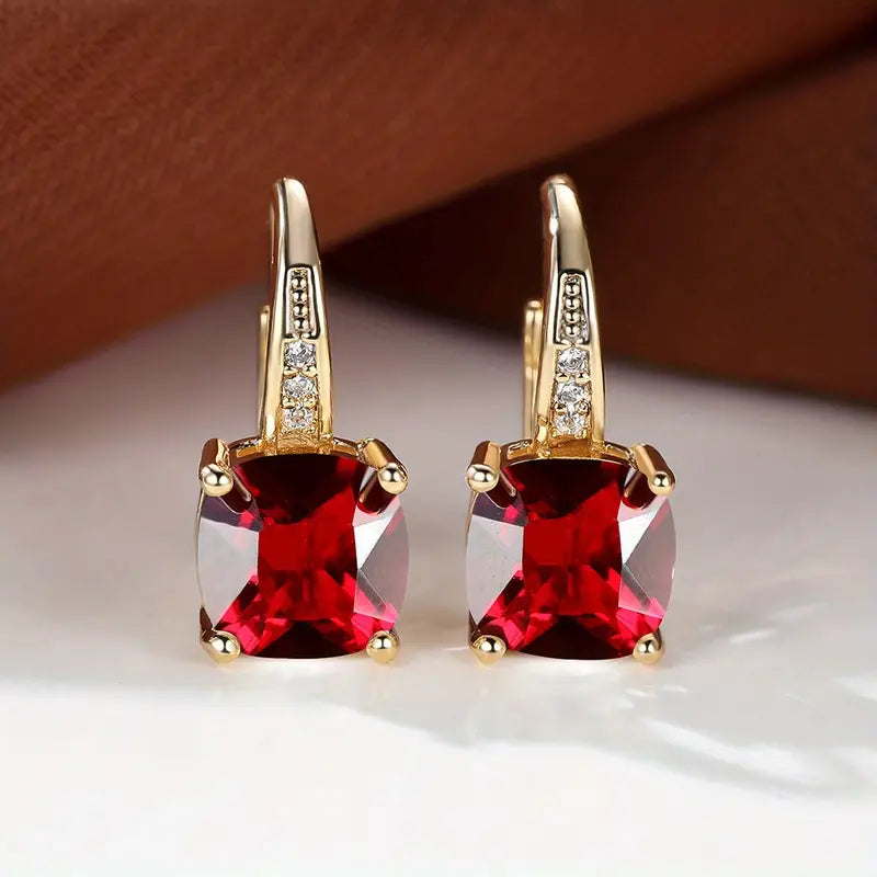 Claudine – Golden Hoop Earrings with Enigmatic Sapphire