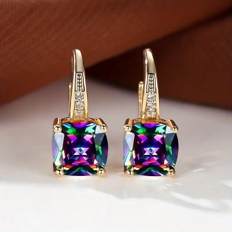 Claudine – Golden Hoop Earrings with Enigmatic Sapphire