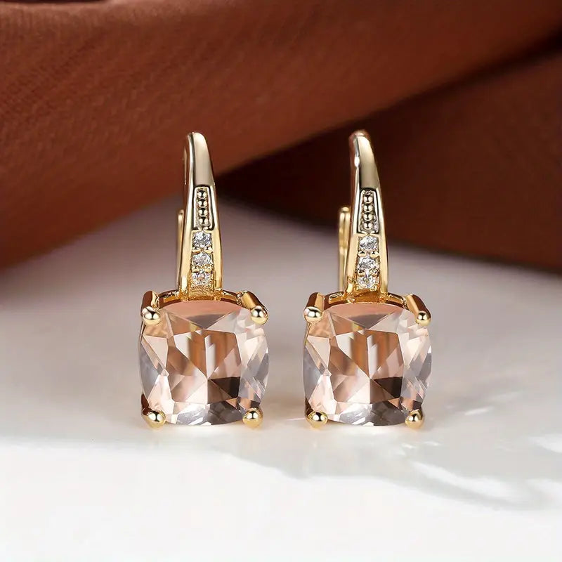 Claudine – Golden Hoop Earrings with Enigmatic Sapphire