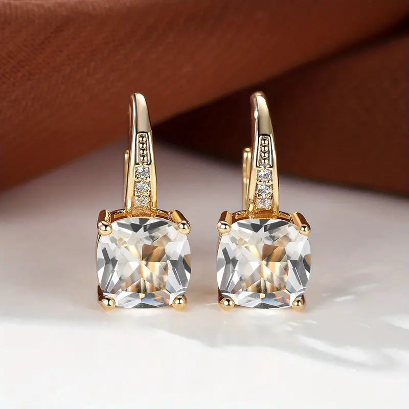 Claudine – Golden Hoop Earrings with Enigmatic Sapphire
