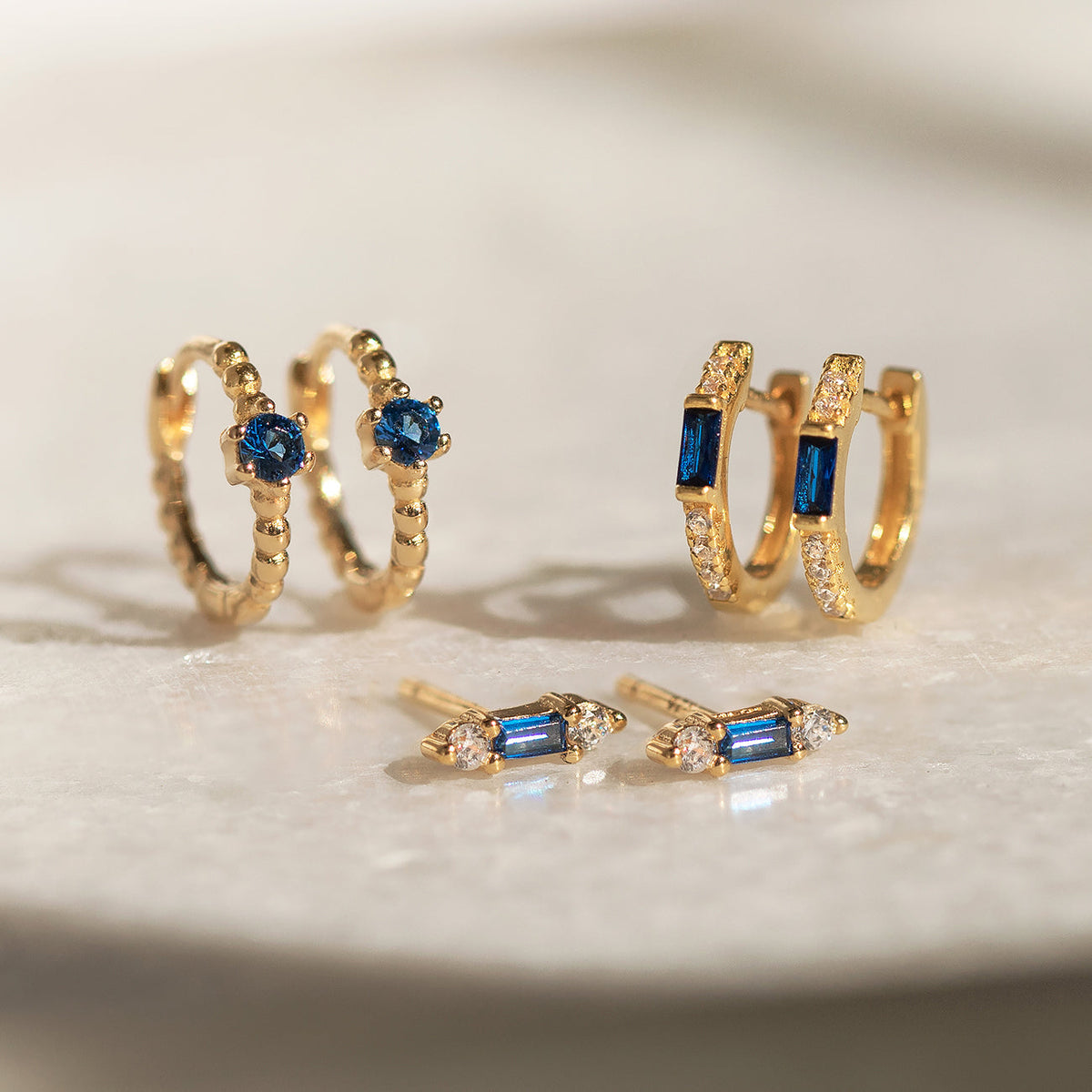 Baguette Huggie Earrings (Blue Sapphire)