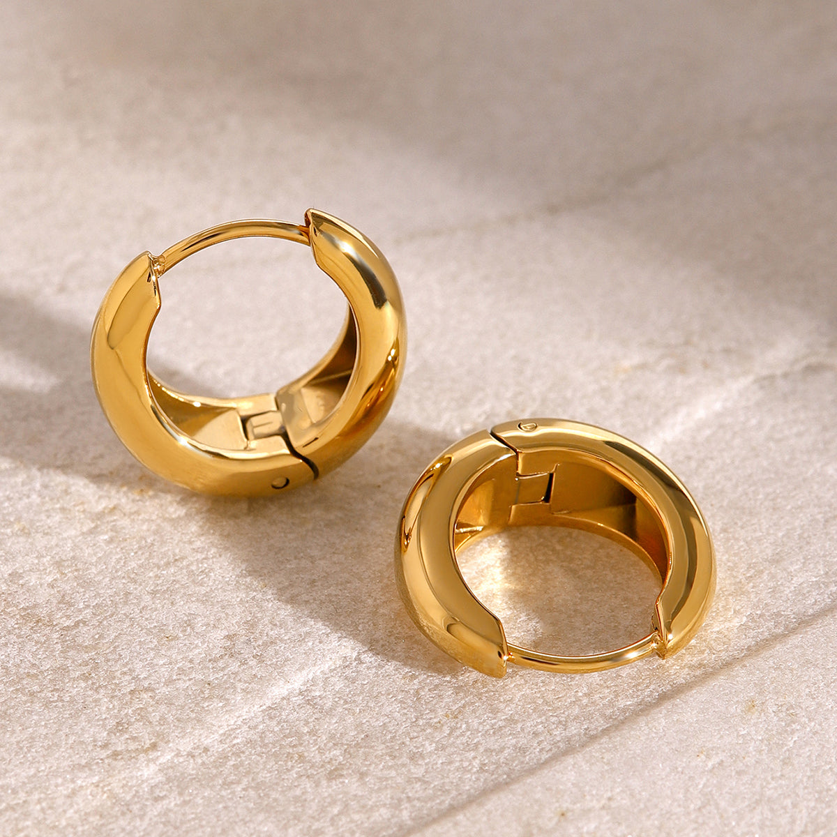 Iris – Geometric Huggie Hoops in Gold