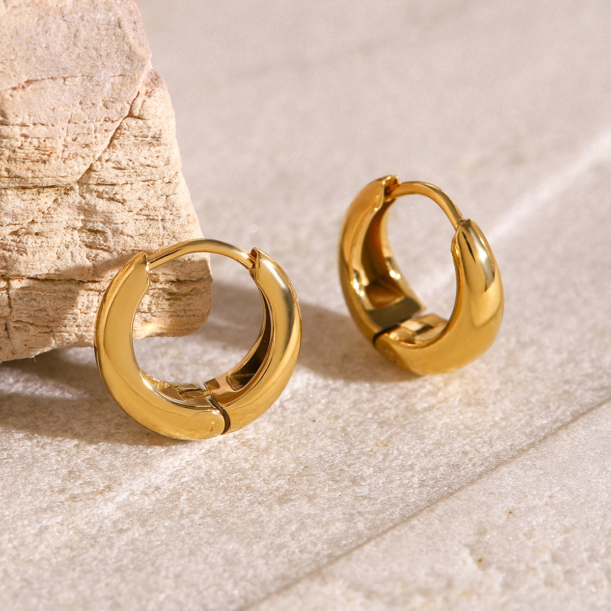 Iris – Geometric Huggie Hoops in Gold