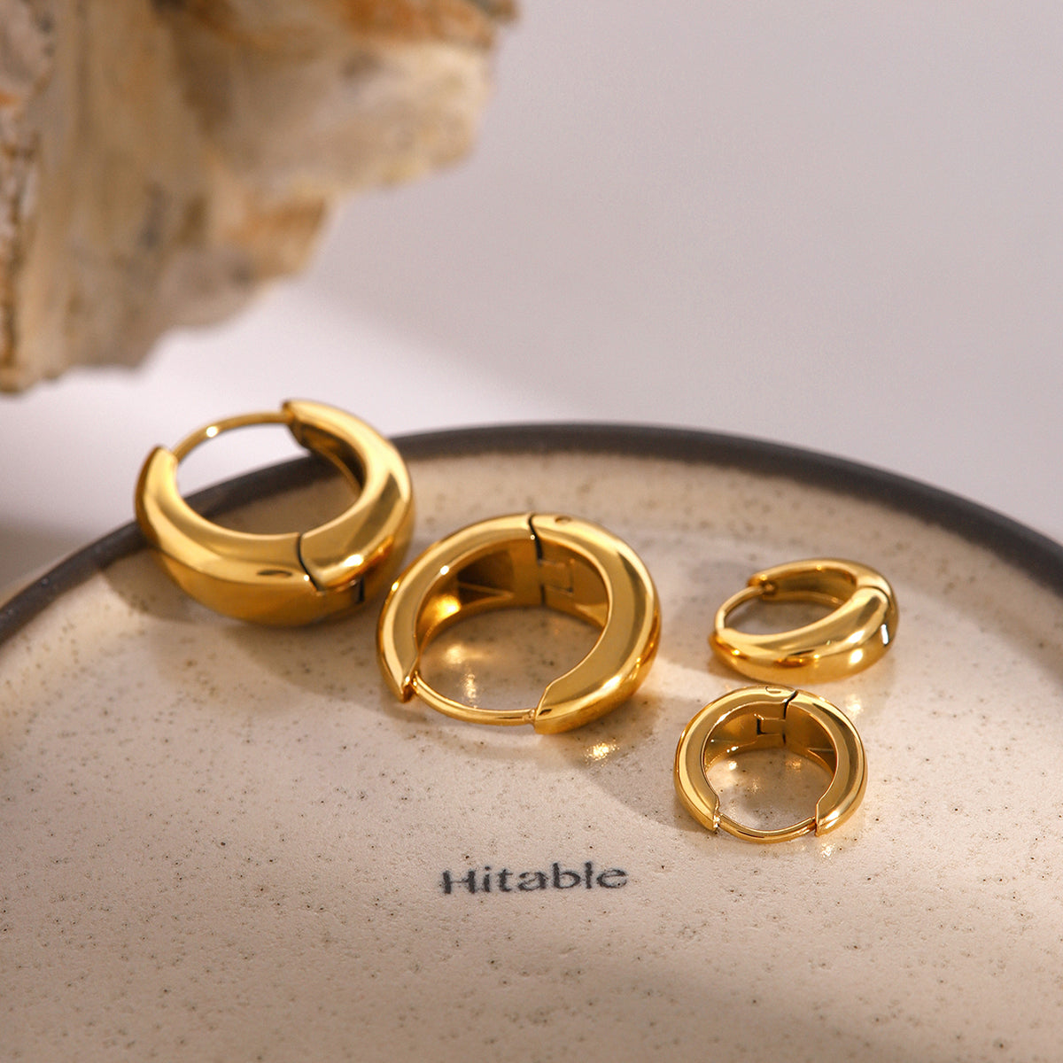 Iris – Geometric Huggie Hoops in Gold
