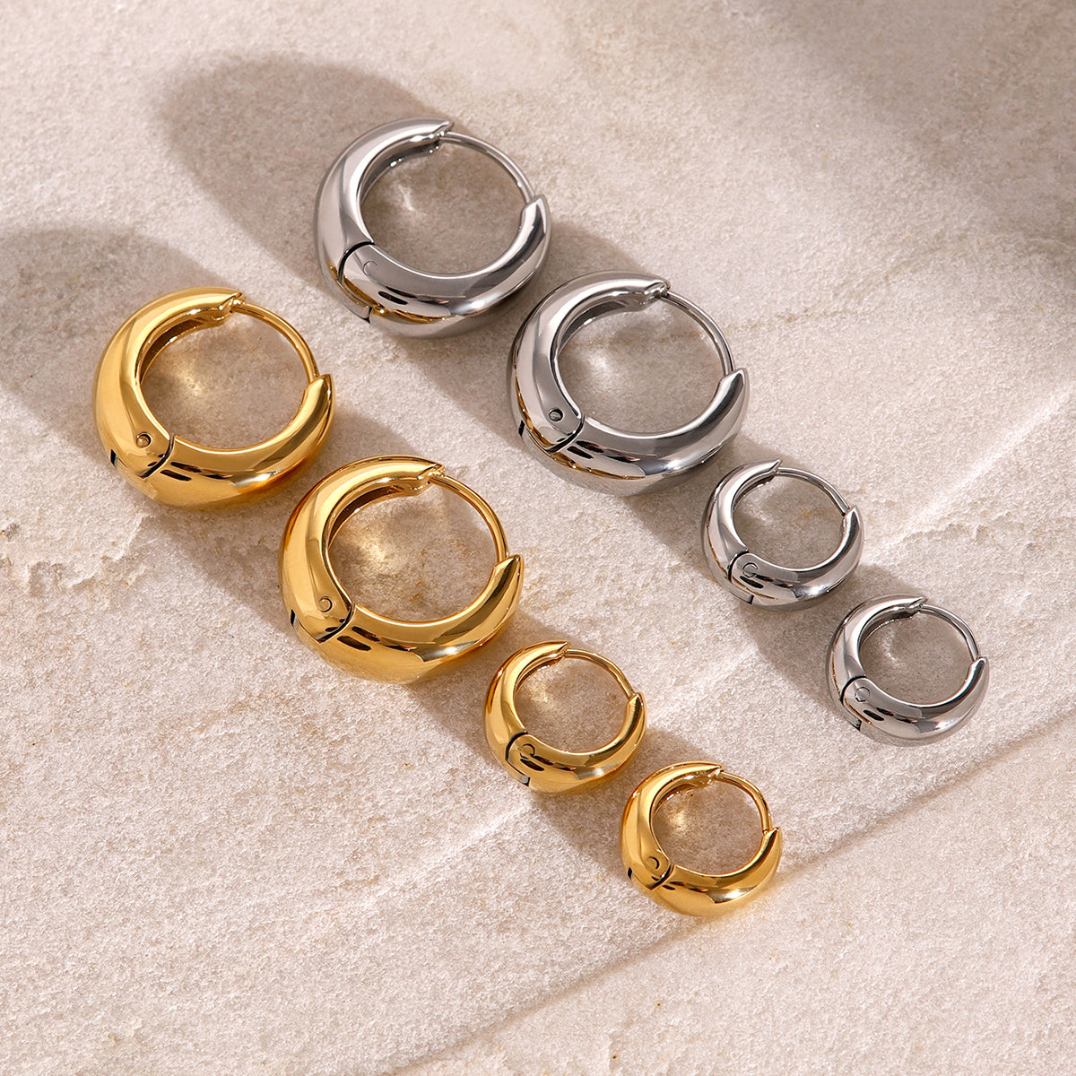 Iris – Geometric Huggie Hoops in Gold