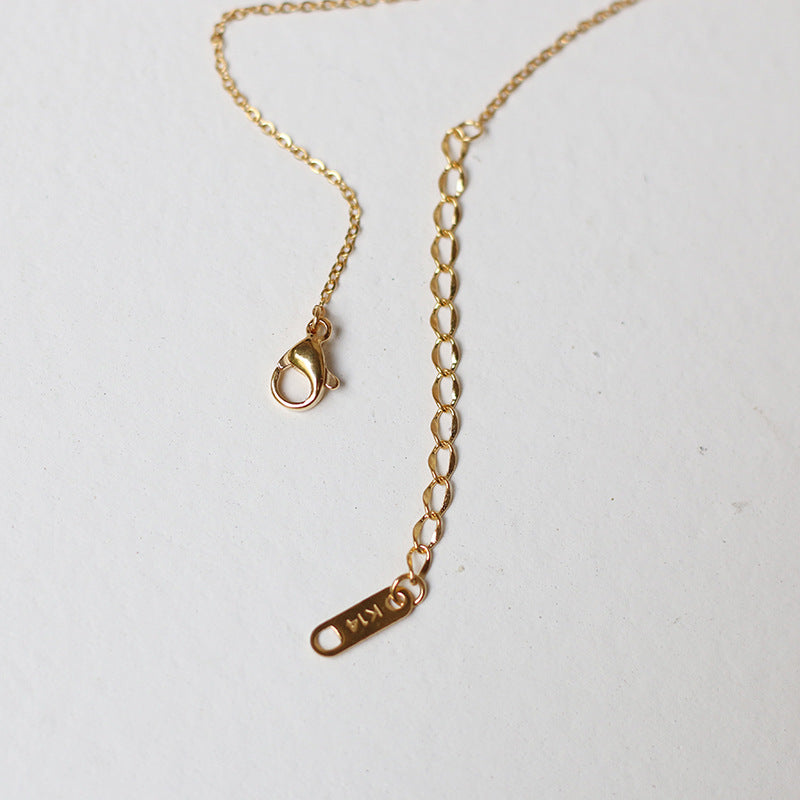 Nelly – Minimalist Cross Chain in Gold
