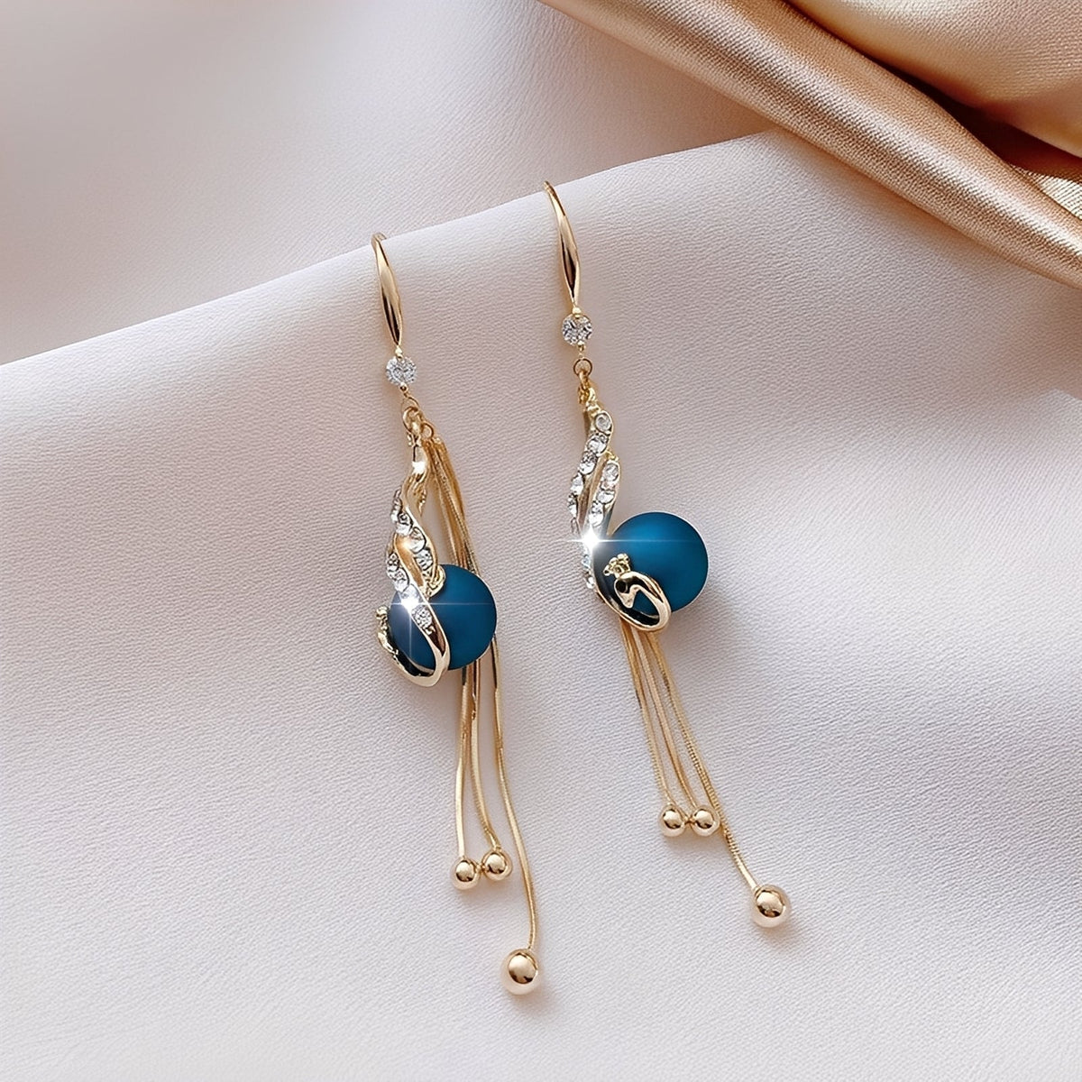 Sheynn – Festive Earrings featuring Blue Pearls