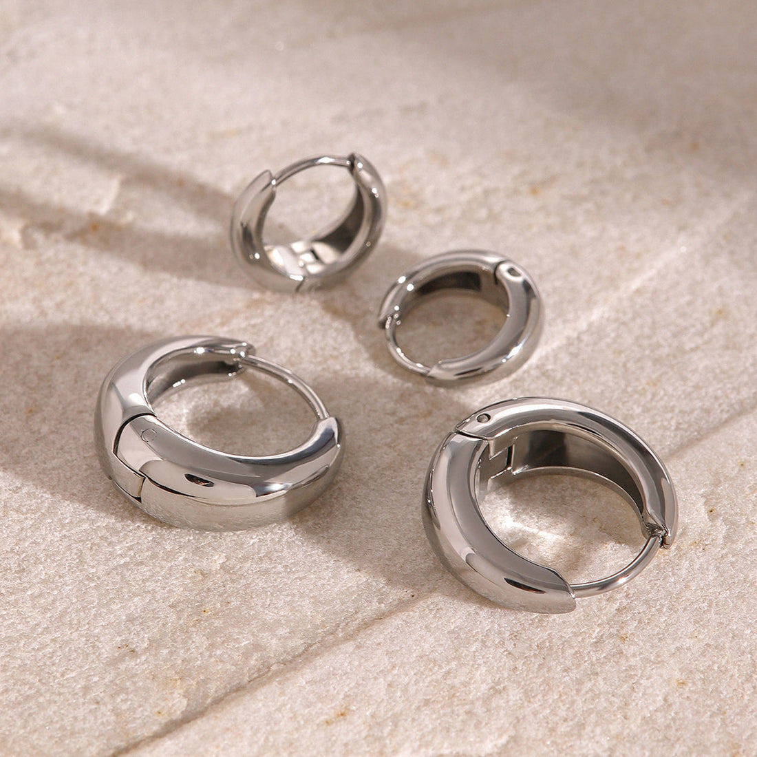 Iris – Geometric Huggie Hoops in Gold