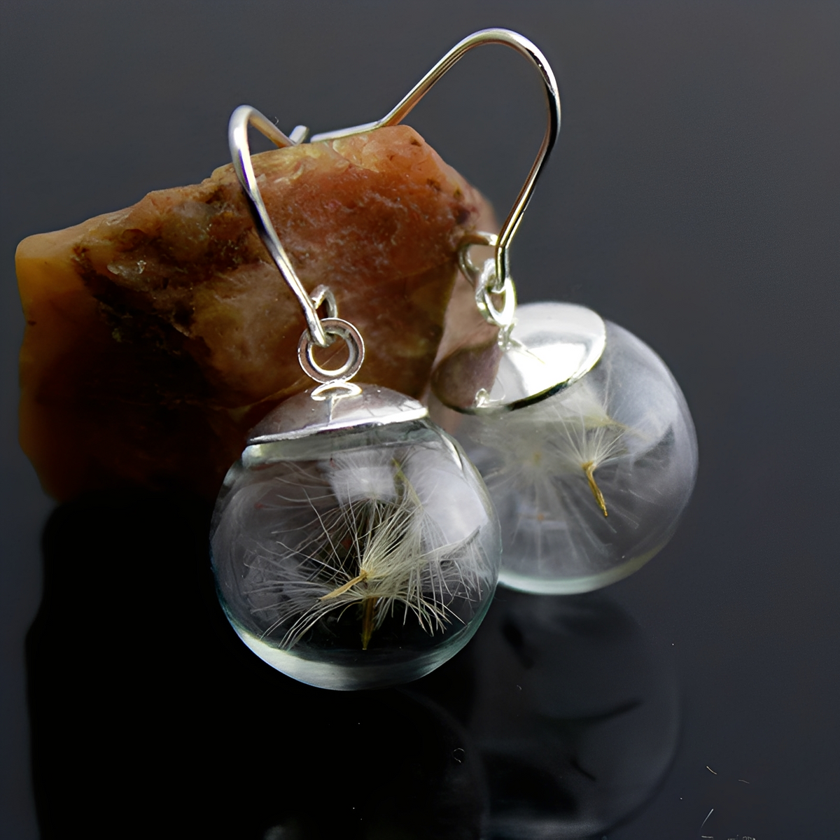 Liora – Silver earrings featuring a dandelion design