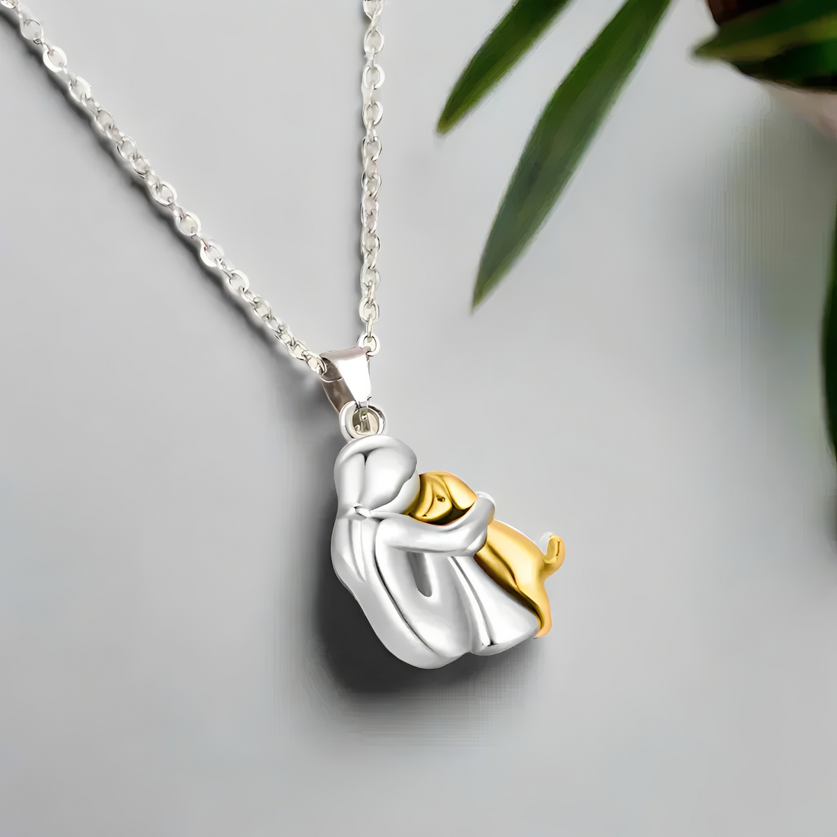 Miwa – Necklace featuring a young girl and dog in embrace