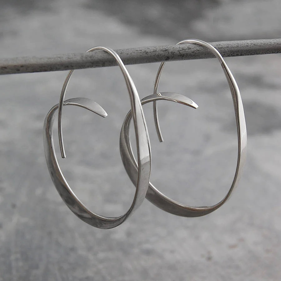 Becca – Earrings featuring a trendy spiral design