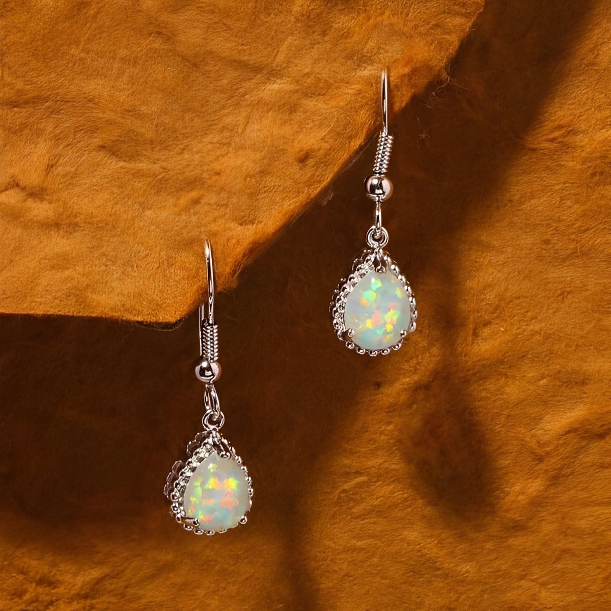 Emeline – Hanging Earrings crafted from Silver & White Fire Opal