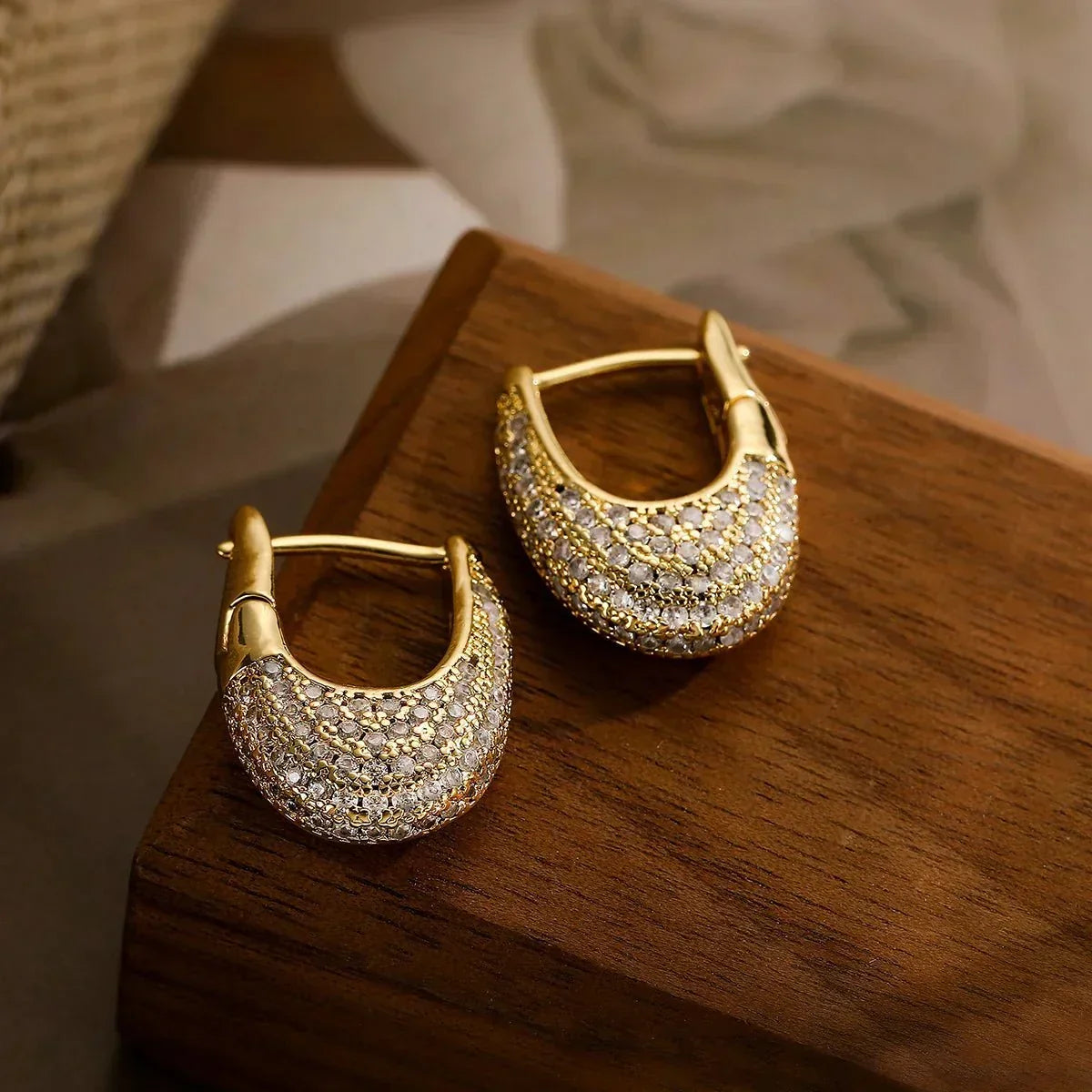 Hara – Wide Shiny Hoops Featuring Diamonds