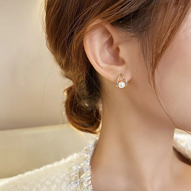 Geah – Earrings Featuring Hollow Golden Pearls