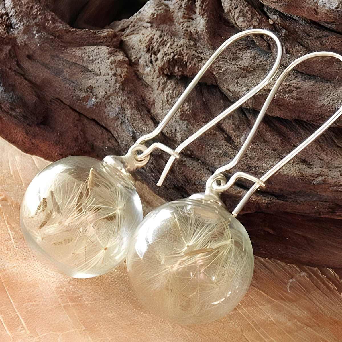 Liora – Silver earrings featuring a dandelion design