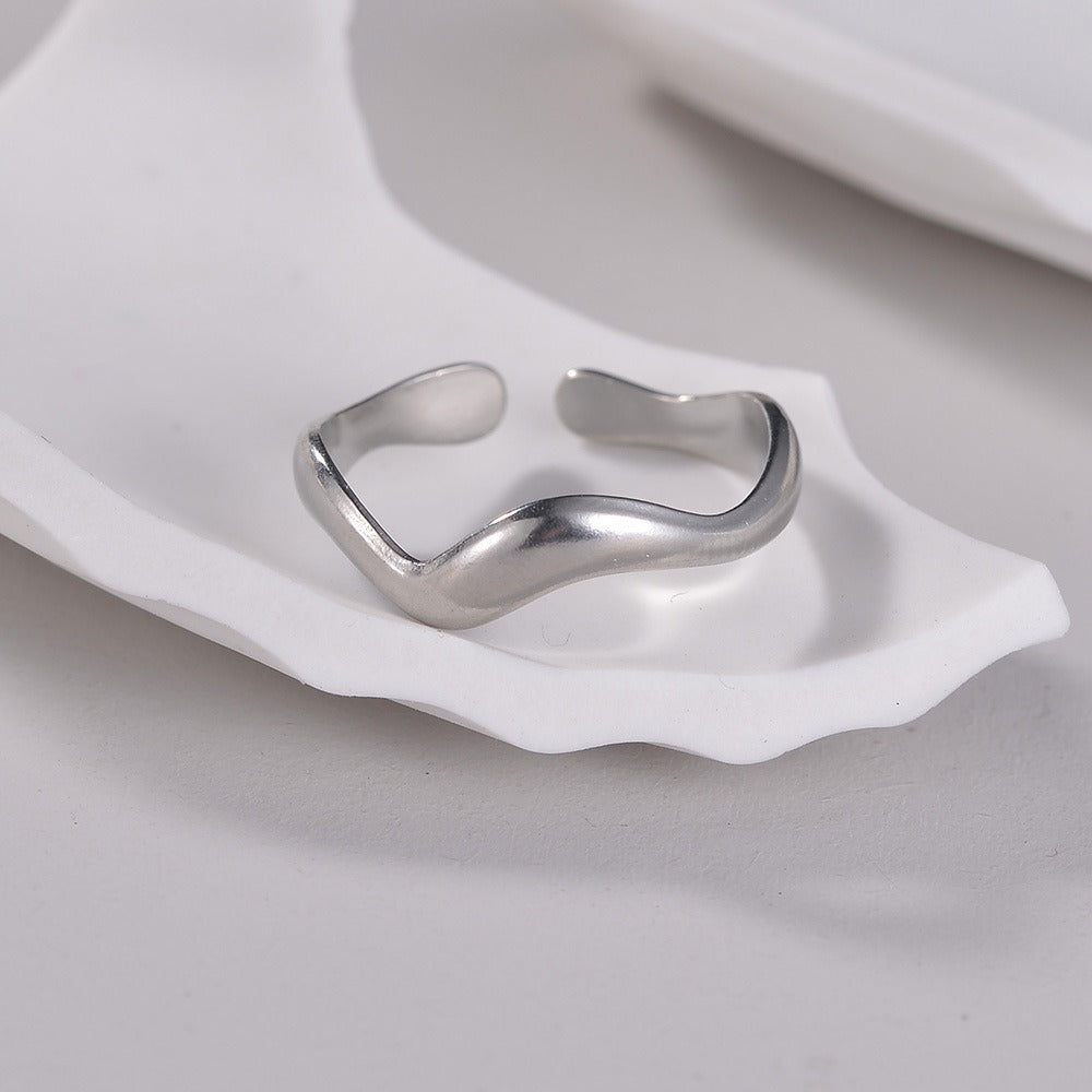 Theva – Open Water Wave Ring in Titanium Steel