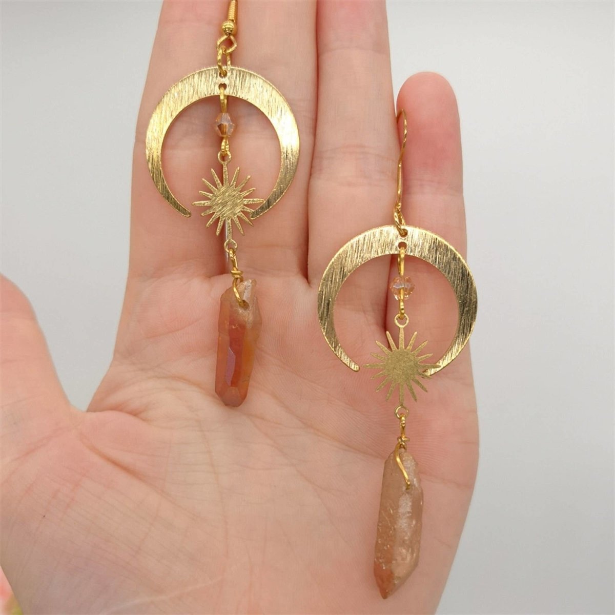 Homa - Crescent Moon Earrings crafted from Tangerine Quartz